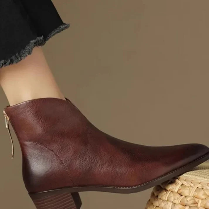 Women's contemporary pointed toe ankle boots with a stylish side zipper. Chic & elegant, suitable for versatile modern fashion.