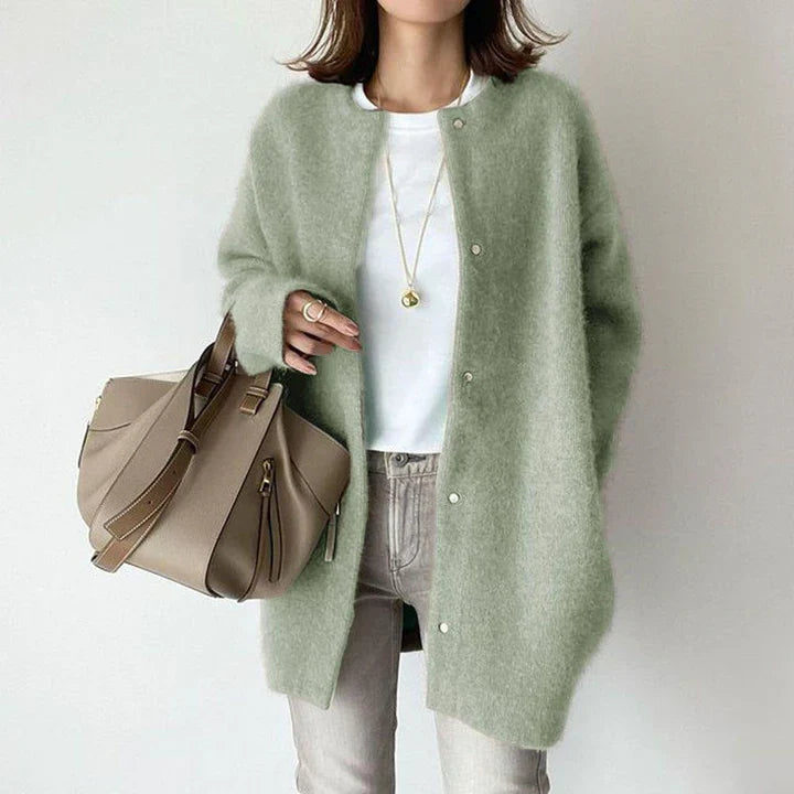 Comfortable women's button-front mid-length cardigan, a versatile layering piece.