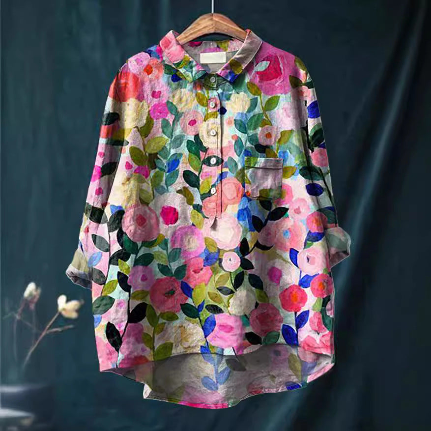 Elegant women's blooming floral summer blouse, a lightweight patterned top for any casual occasion.