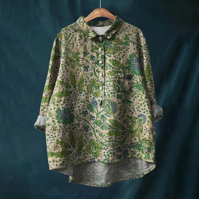 Model wearing a women's blooming floral summer blouse, comfortable long sleeve top for summer.