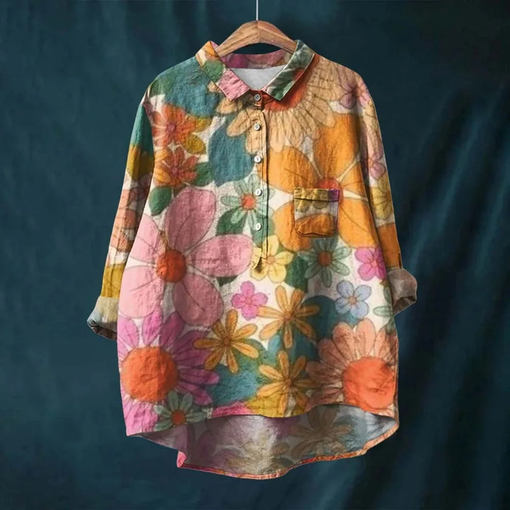 Close-up of the blooming floral pattern on a women's lightweight summer blouse fabric.