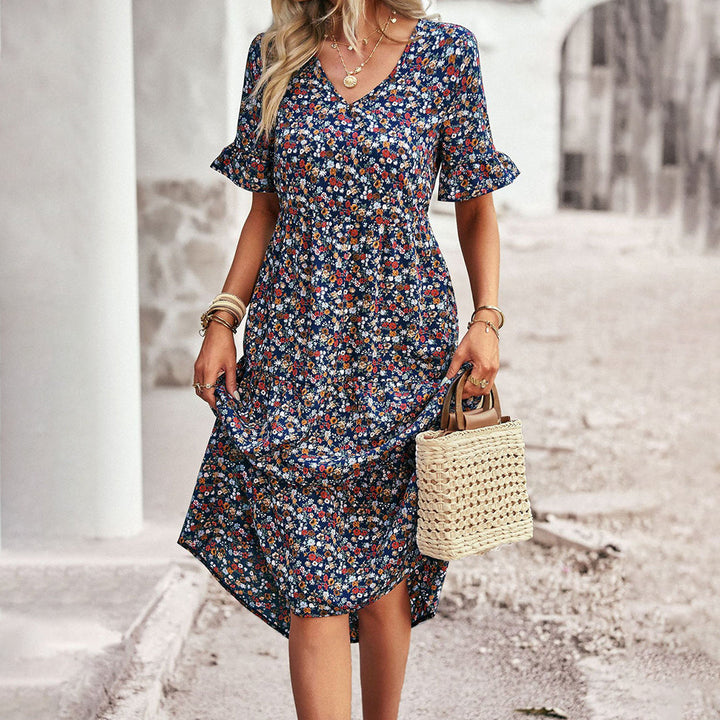 Elegant women's floral midi dress featuring a v-neck, flutter sleeves, and a flowy bohemian summer design.