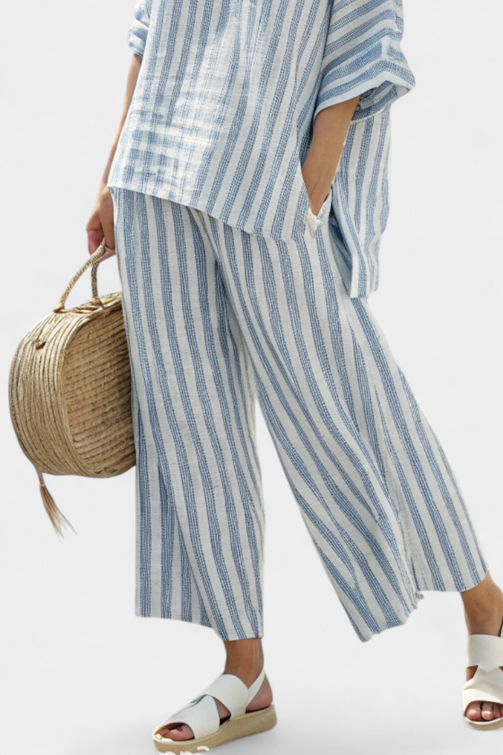 Coastal style women's blue striped two-piece set. Relaxed fit top and pants for easy, comfortable summer fashion.