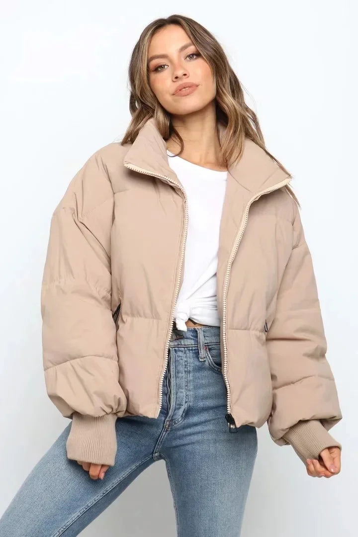 Stylish women's quilted puffer jacket, ideal for cold winter weather outerwear.