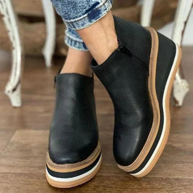 Supportive women's comfort ankle boots with platform sole & mid heel, designed for all-day wear.
