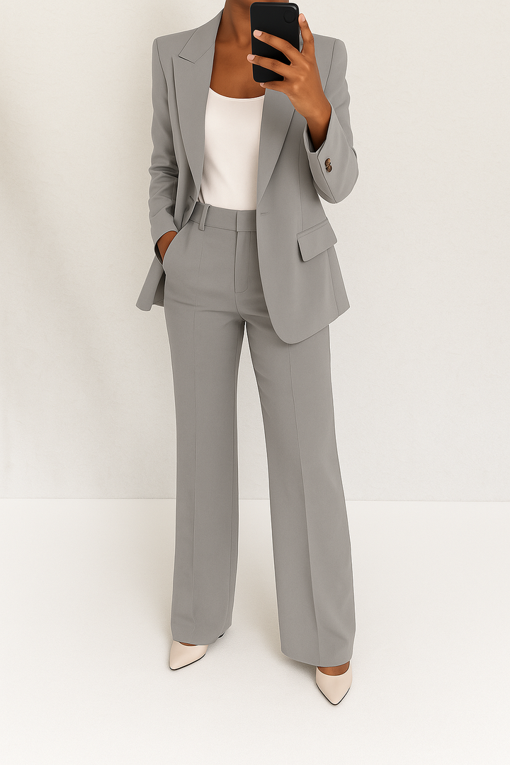 Versatile women's tailored blazer & trouser suit set, ideal for elegant office attire or formal events.