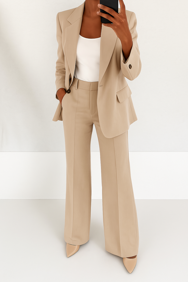 Sophisticated women's elegant tailored suit with sleek blazer and trousers for business & formal occasions.