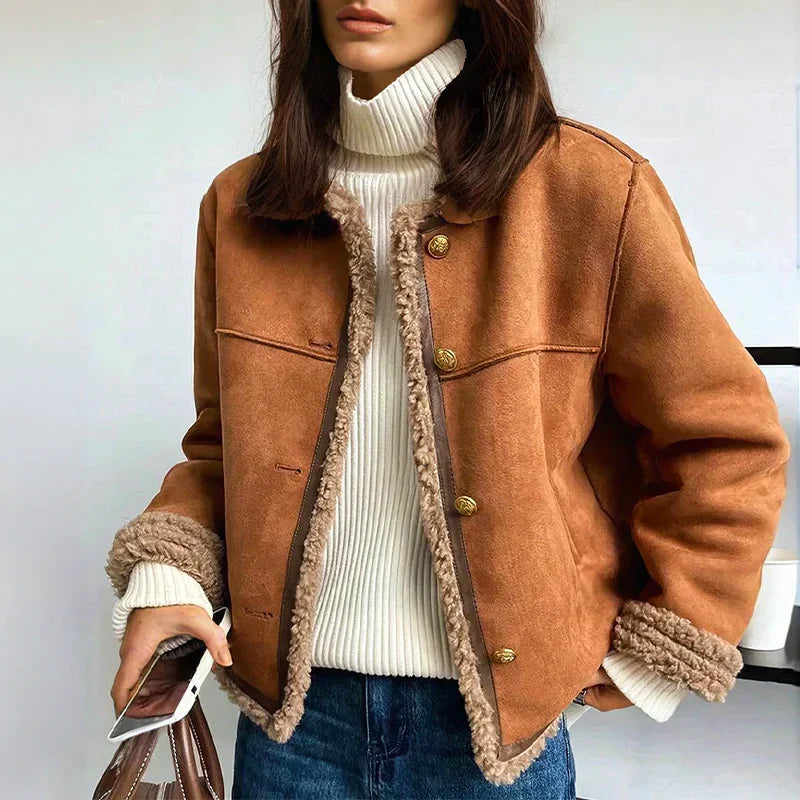 Warm women's insulated winter jacket, a stylish and cozy outerwear choice for cold weather elegance.