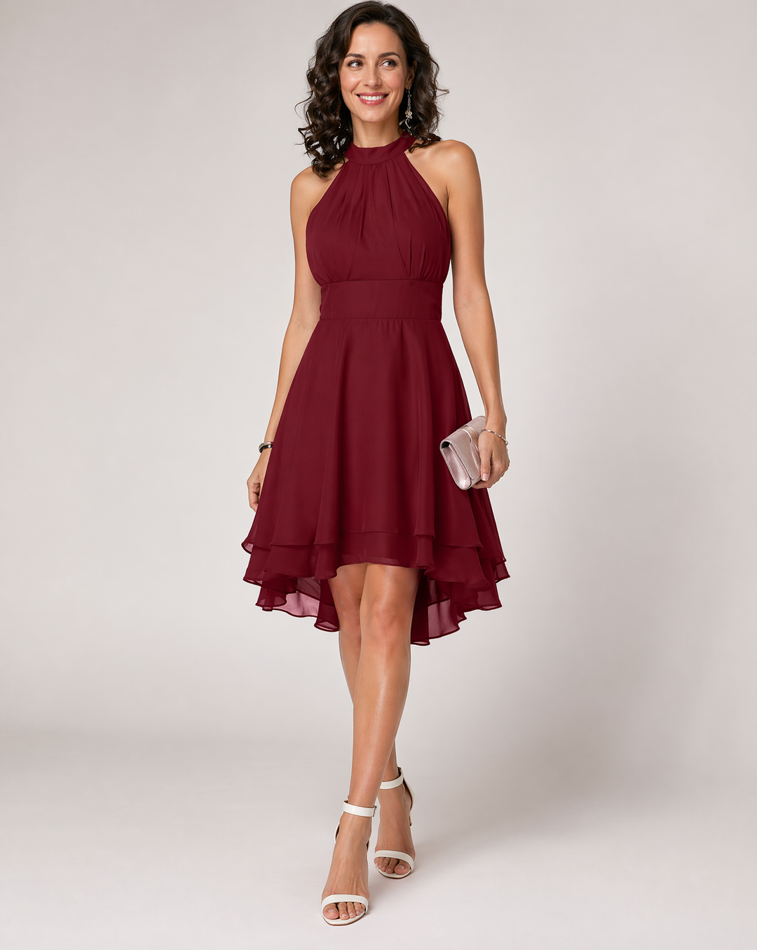 Flowy halterneck midi dress for women, featuring a beautiful pleated tiered skirt & asymmetric hem.