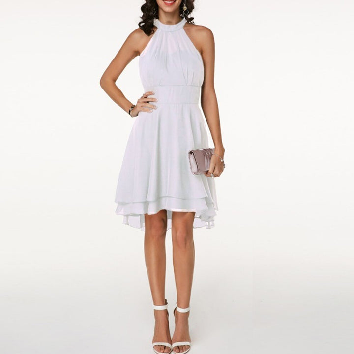 Elegant flowy women's halterneck midi dress with a beautiful pleated tiered skirt for occasions.