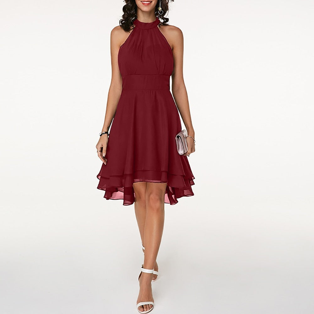 Wedding guest women's midi dress, elegant halterneck design with a stunning pleated tiered skirt.