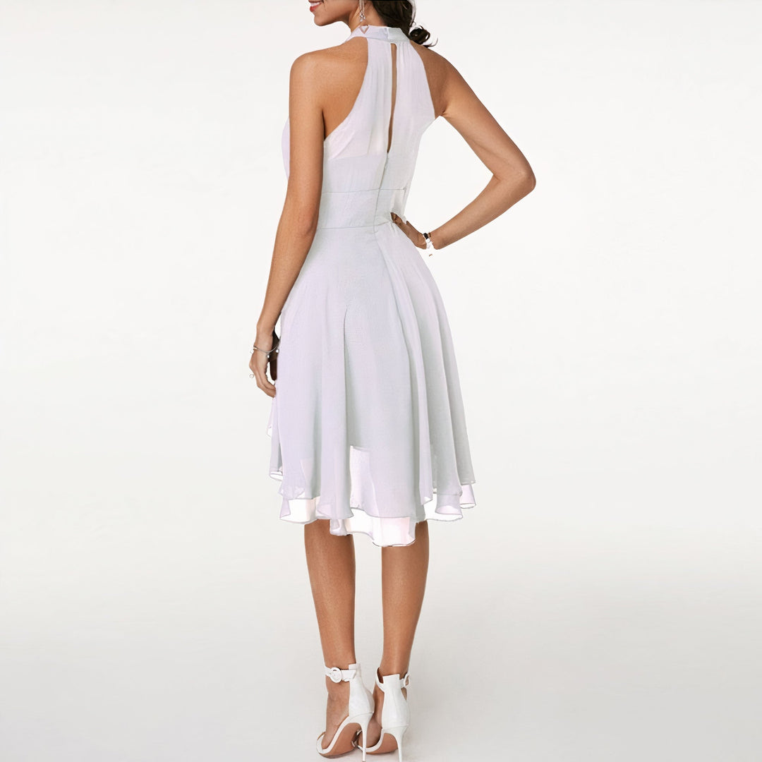 Beautiful women's elegant ruffled mini evening dress, perfect for a chic party or cocktail event.