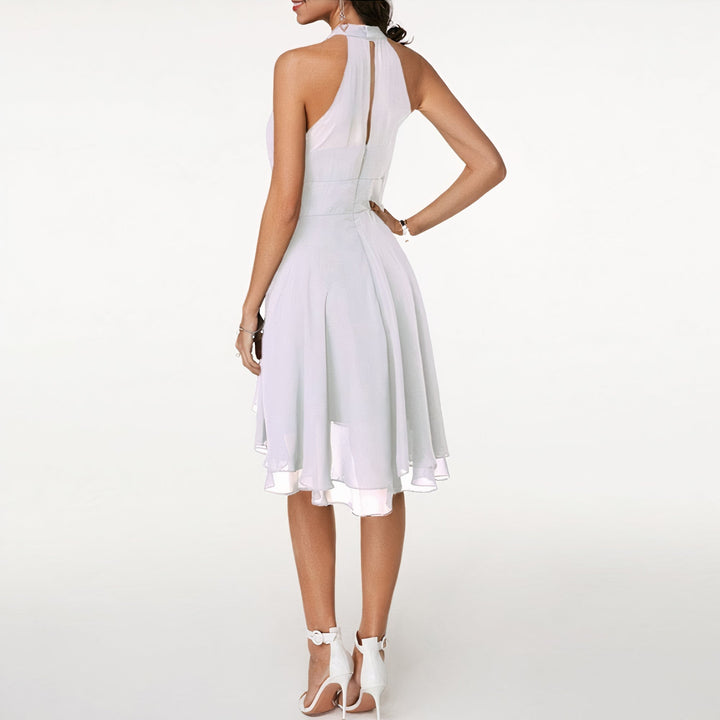 Beautiful women's elegant ruffled mini evening dress, perfect for a chic party or cocktail event.