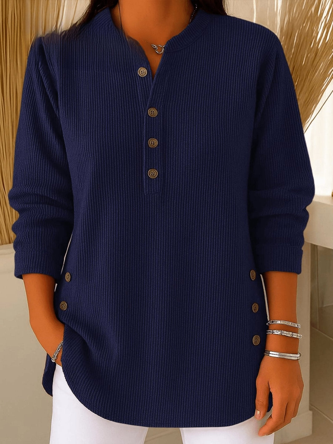 Relaxed fit women's longline ribbed tunic with a button front Henley neckline.