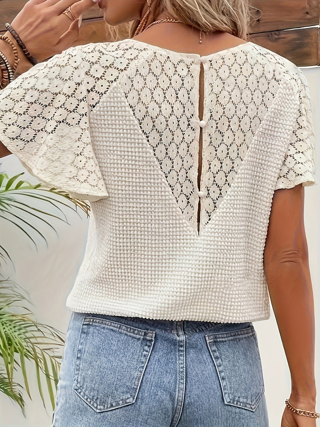 Women's lightweight V-neck spring top with elegant openwork sleeves, perfect for casual or everyday wear.