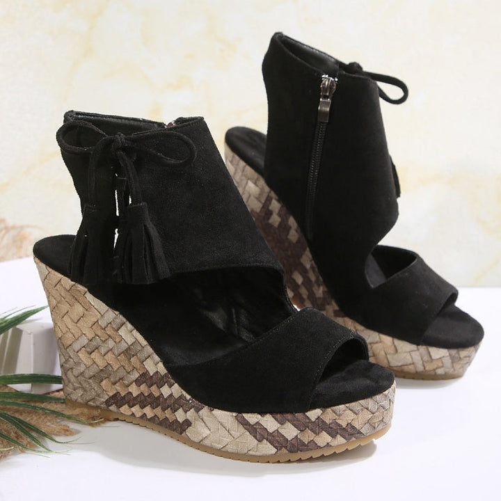 Elegant women's platform sandals with high wedge and decorative tassels for evening or day.