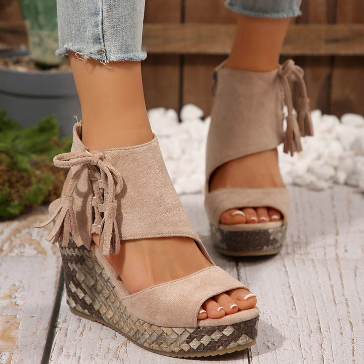 Casual yet stylish women's open-toe high wedge sandals, adorned with playful tassels.