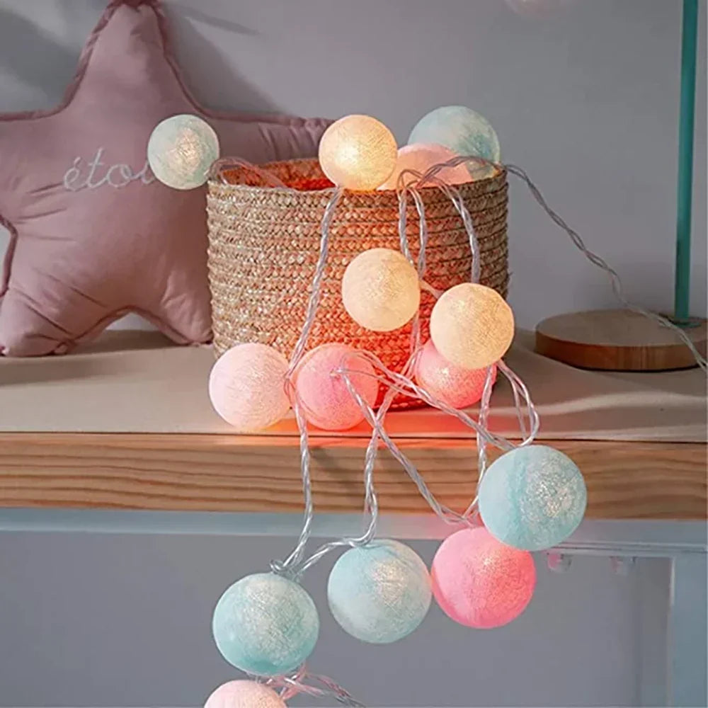 Charming cotton ball fairy lights, perfect for rustic decor or bohemian room aesthetics.
