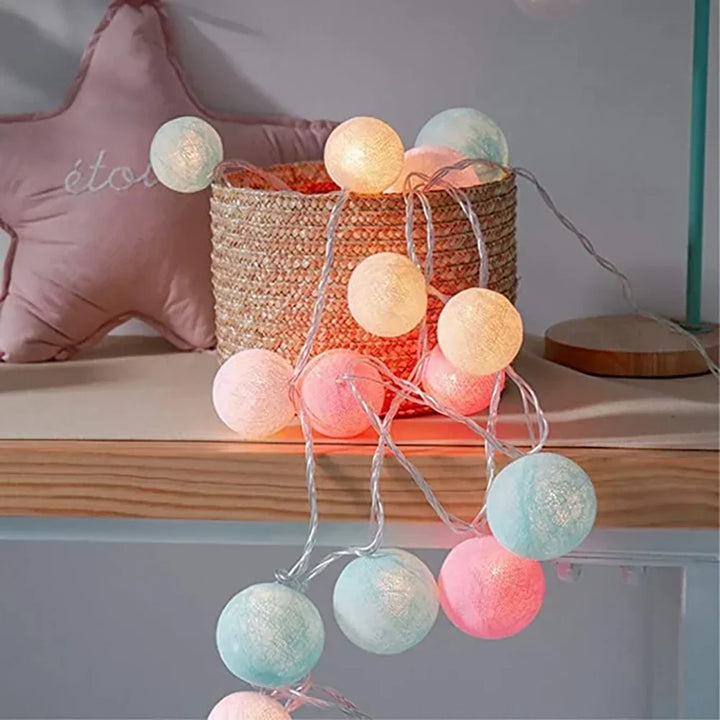 Charming cotton ball fairy lights, perfect for rustic decor or bohemian room aesthetics.