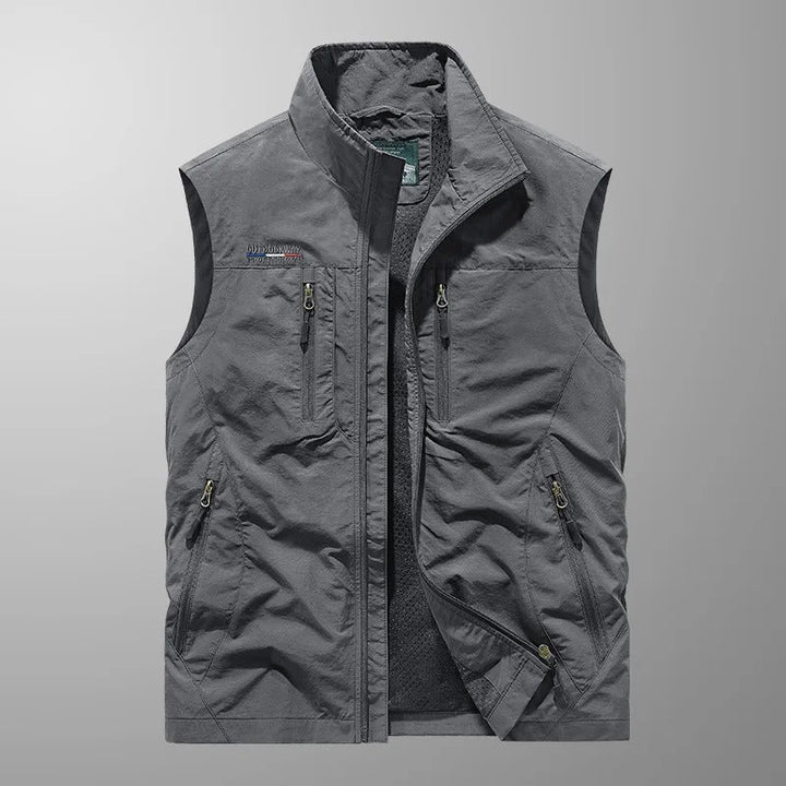 Durable, water & wind resistant men's sleeveless cargo vest. Lightweight design for functional outdoor adventure gear.