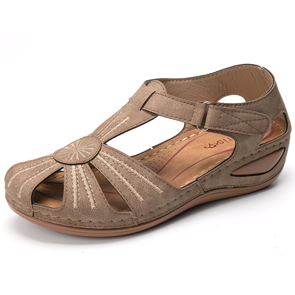 Slip-on women's wedge sandals with arch support for easy summer walking. Comfortable & stylish outdoor casual footwear.