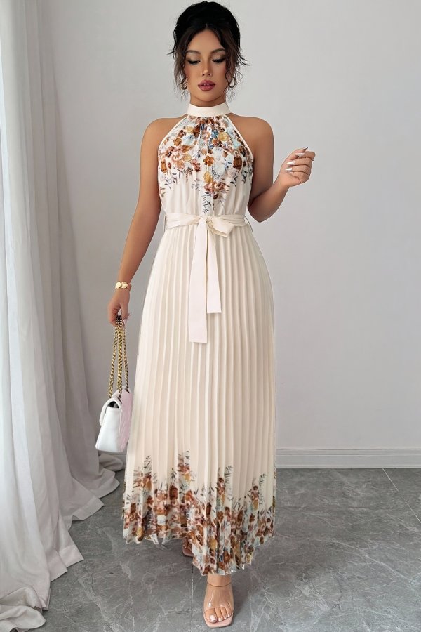 Elegant women's midi dress with a stunning floral pattern, pleated skirt, halter neck, and tie-waist.