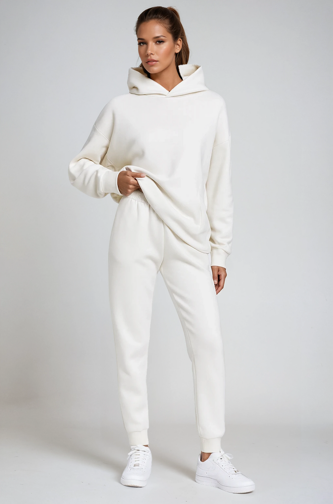 Women's cozy hooded jogging set. Soft loungewear sweatshirt & joggers for ultimate comfort and relaxed style.