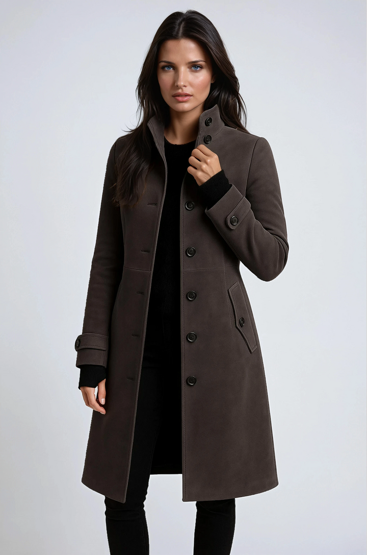 Chic women's classic longline trench coat. Sophisticated outerwear, ideal for winter and fall fashion. Elegant tailored design.