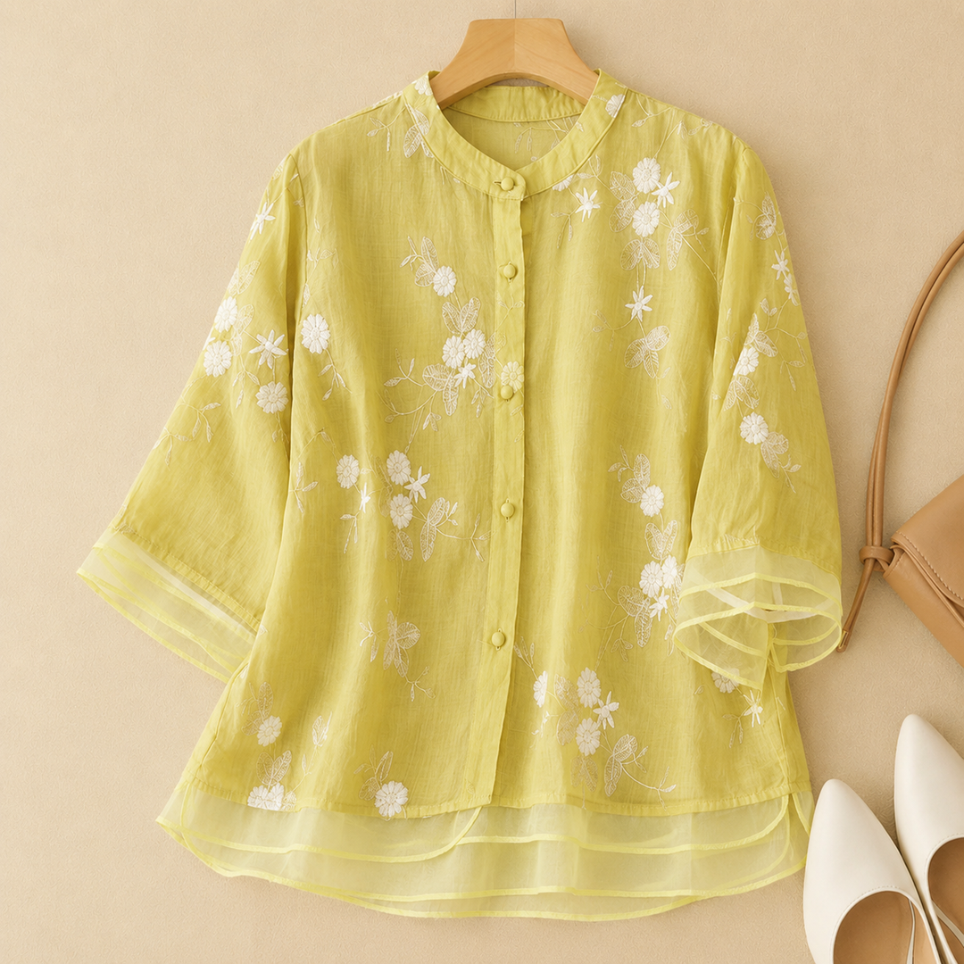 Sophisticated women's embroidered blouse, an elegant flowing top combining comfort with chic fashion.