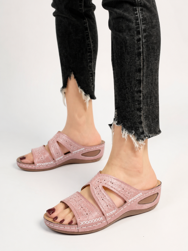 Casual women's slip-on sandals featuring beautiful embroidery and a comfy sole.