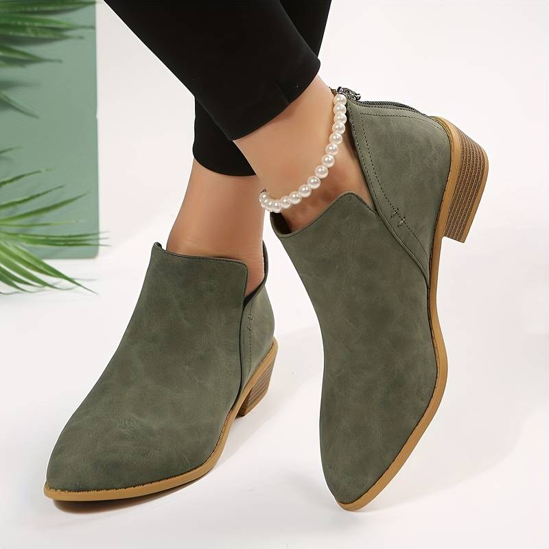 Women's chic black leather ankle boots, perfect for effortless autumn style and everyday comfort.
