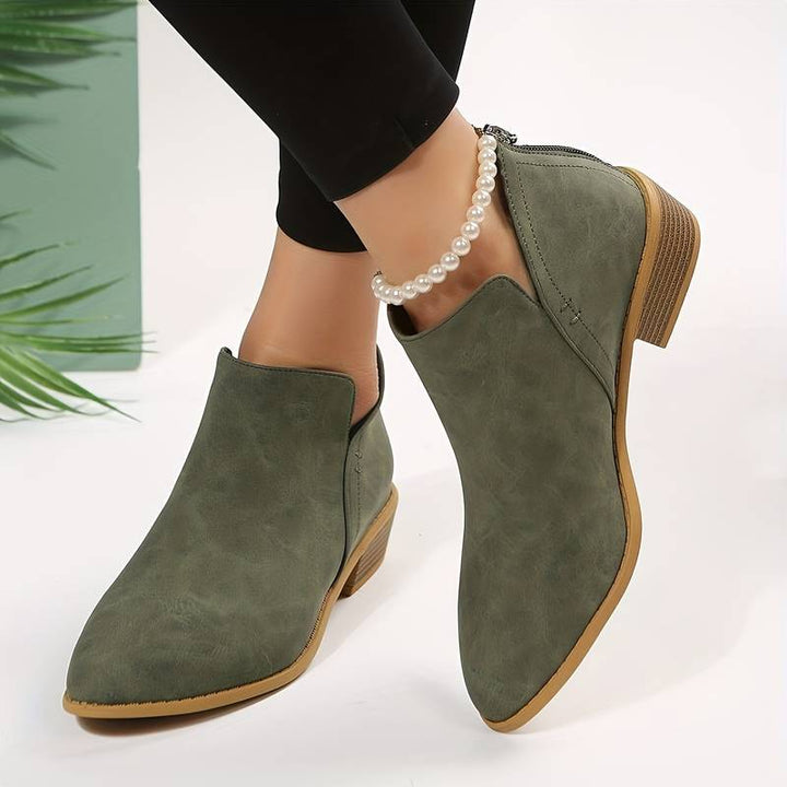 Women's chic black leather ankle boots, perfect for effortless autumn style and everyday comfort.