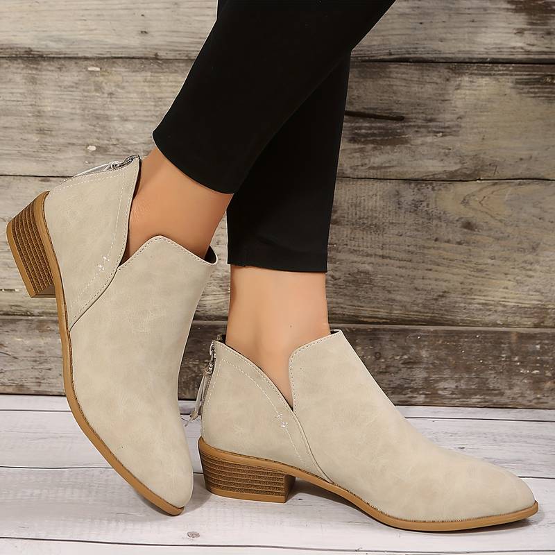 Stylish women's ankle boots, versatile for fall fashion, with a comfortable design for walking.