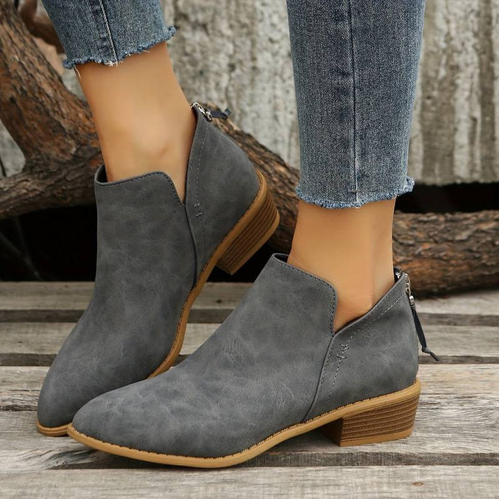 Close-up of women's comfortable chic ankle boots, ideal for casual wear and autumn fashion.