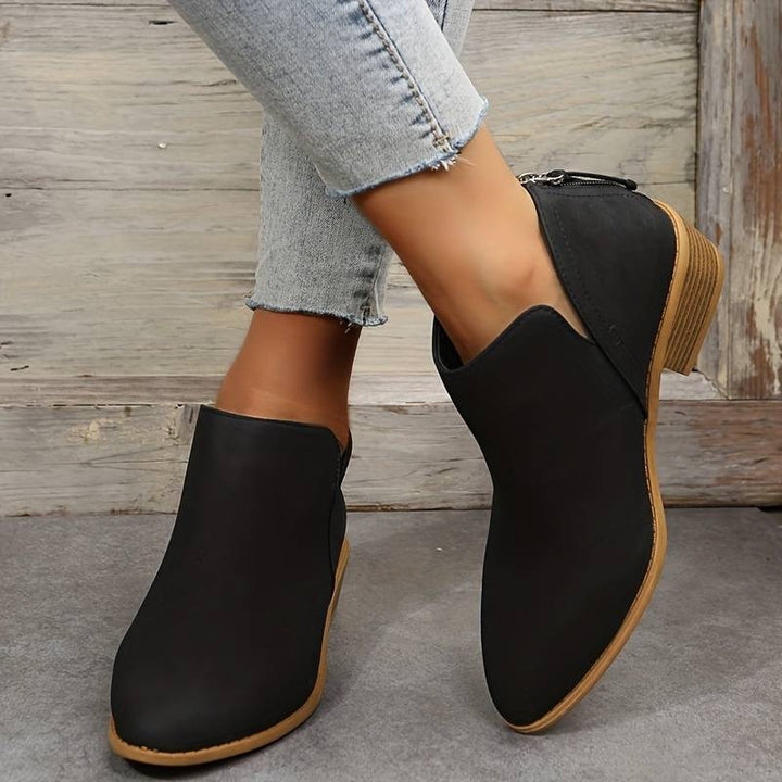 Elegant women's ankle boots, designed for chic autumn outfits and comfortable everyday wear.