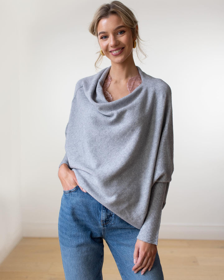 Chic black off-shoulder knit sweater, women's long sleeve top with relaxed fit, ideal for casual or evening.