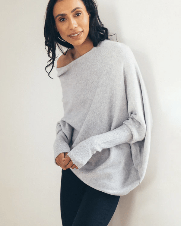 Stylish blue off-shoulder women's sweater, long sleeve knit top with relaxed fit, perfect for fall elegance.