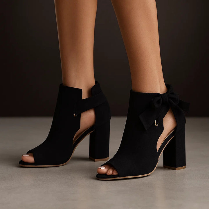 Stylish women's high heels: peep toe, comfortable block heel, and elegant ankle bow detail.