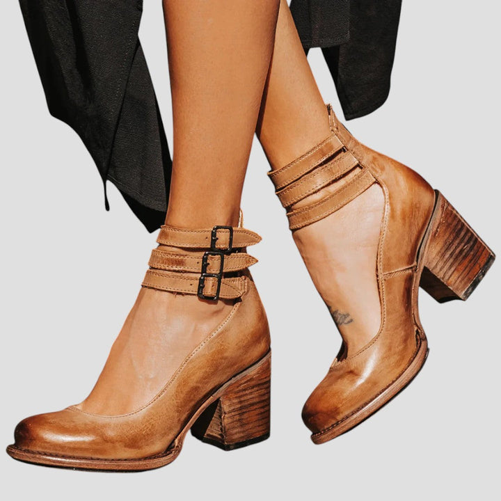 Chic women's double strap block heel ankle boots, ideal comfortable footwear for everyday and versatile styling.