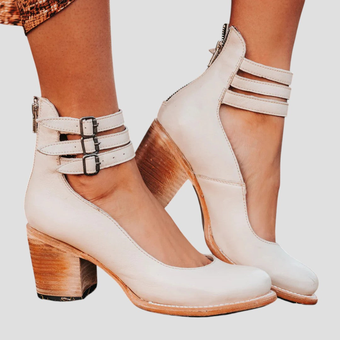 Versatile women's fashion ankle boots featuring elegant double straps and a comfortable block heel design.