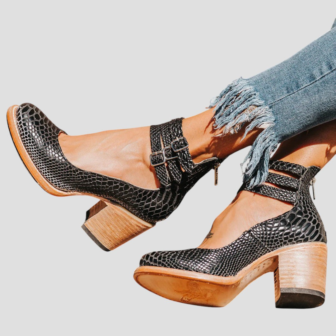 Stylish women's black double strap ankle boots with a supportive block heel for all-day comfort & fashion.