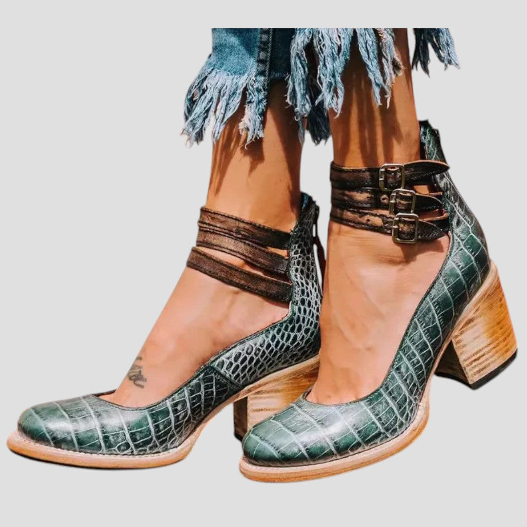 Fashionable women's block heel ankle boots, double strap detailing for trendy fall and winter style & comfort.