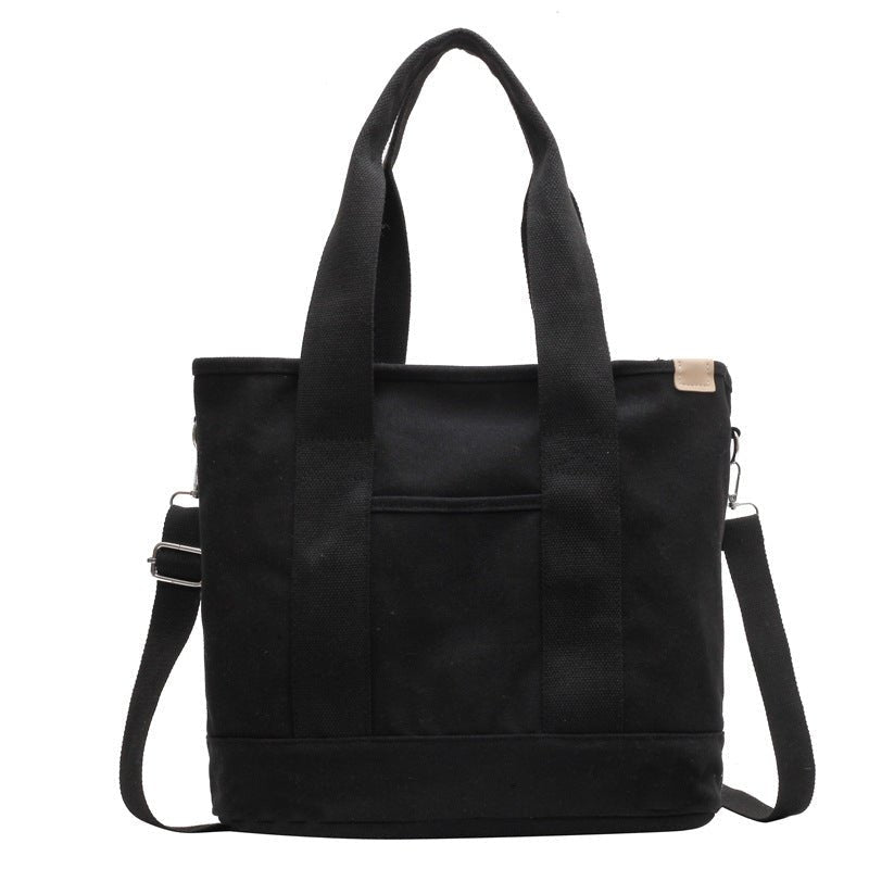 Women's multifunction canvas tote bag with adjustable strap, ideal for daily use.