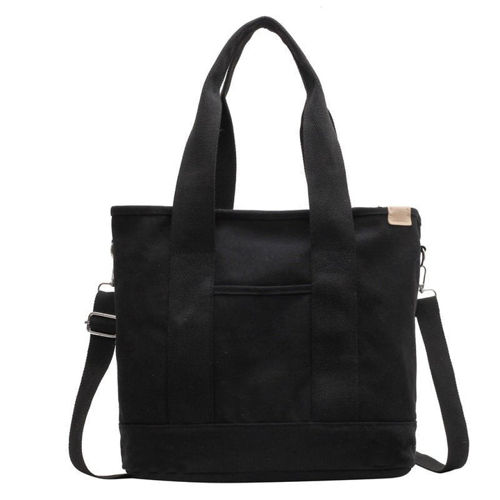 Women's multifunction canvas tote bag with adjustable strap, ideal for daily use.