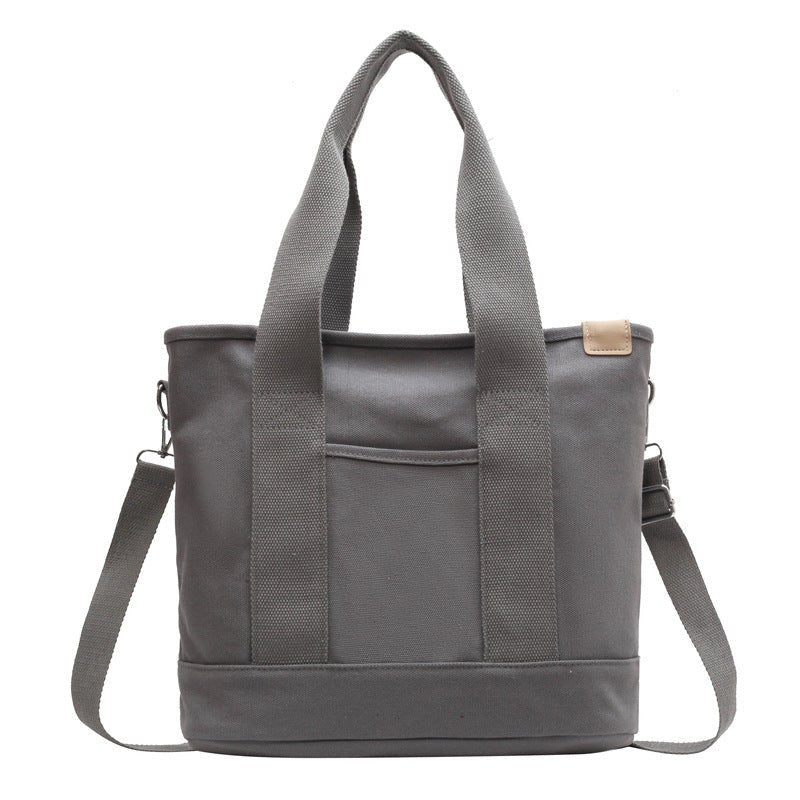 Women's durable canvas tote bag. Adjustable strap, perfect for travel & everyday style.