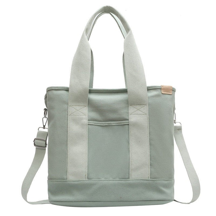 Travel-friendly multifunction canvas tote bag for women, spacious and durable for all adventures.