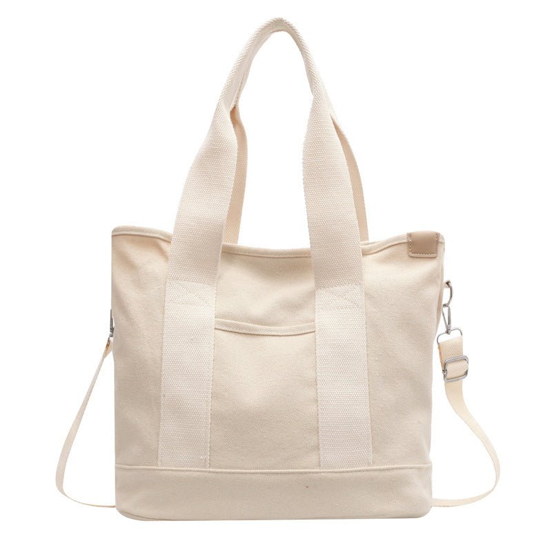 Women's canvas shoulder bag with adjustable strap, large capacity for all your items.