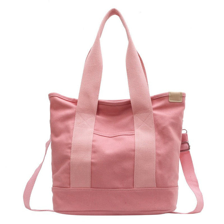 Chic women's canvas crossbody bag, practical and stylish, an essential fashion accessory.
