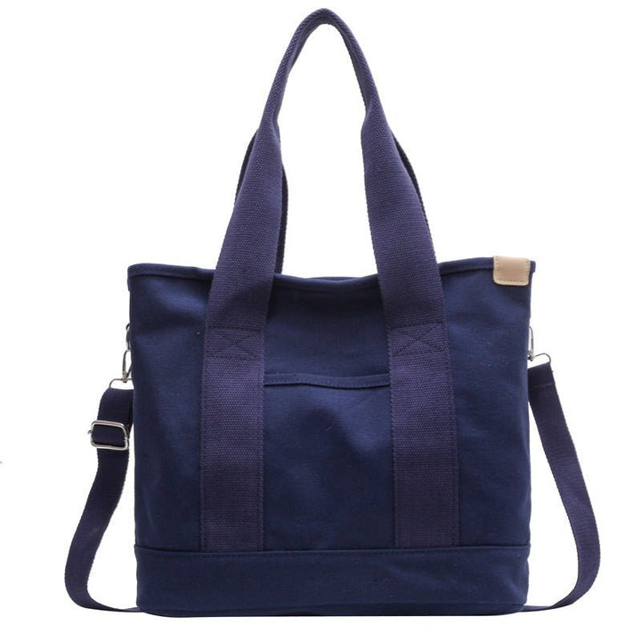 Multifunction canvas tote bag for women, easily converts to shoulder bag or crossbody bag.