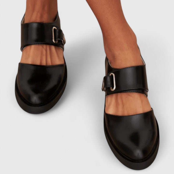 Fashionable women's black Mary Jane shoes with a thick chunky sole and elegant buckle strap, perfect platform loafers.